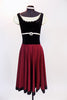 Ballet character dress has cream cap-sleeved & black velvet vest with crystals. Waist has a Swarovski broach & skirt is burgundy stretch with black satin trim. Front