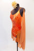 Burnt orange camisole leotard has a tie-dye effect with gold leaf pattering, scalloped low back with straps & an attached chiffon skirt. Has hair piece & scarf. Side
