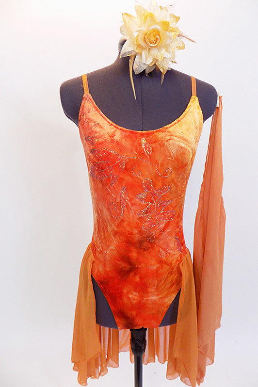 Burnt orange camisole leotard has a tie-dye effect with gold leaf pattering, scalloped low back with straps & an attached chiffon skirt. Has hair piece & scarf. Front Zoom