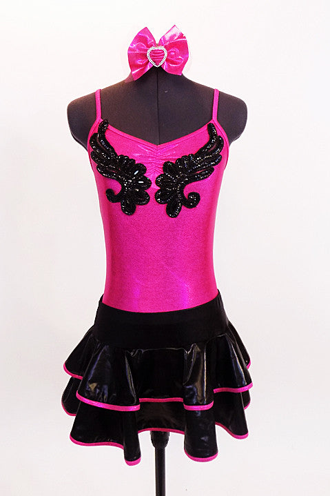 Metallic fuchsia pinch front camisole leotard has black sequined applique front. Comes with shiny black & fuchsia ruffled, skirt &matching hair accessory. Front