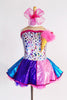 Silver leotard with colourful dots and an attached  ice cream cone with pink feather ice cream. Has  purple-pink-blue skirt with matching coloured petticoat. Front