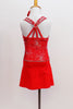 Red camisole style leotard dress has silver firework motif with crystal centers & straps that criss-cross around crystal ring on back. Has matching hair piece. Back