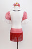White leotard has red-white checkered bust area,  pouf sleeves with lace,  silver sequins and red fringe. Has checkered hip wrap with red fringe & hair bow. Back