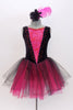 Black velvet tank leotard has pink lace insert in the bodice. Has an attached black and pink tulle romantic tutu skirt. Comes with  feather hair accessory. Front