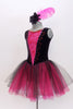 Black velvet tank leotard has pink lace insert in the bodice. Has an attached black and pink tulle romantic tutu skirt. Comes with  feather hair accessory. Side