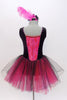 Black velvet tank leotard has pink lace insert in the bodice. Has an attached black and pink tulle romantic tutu skirt. Comes with  feather hair accessory. Back