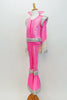 70s style Disco hot pink &silver flare jumpsuit has sequined leg, hip, shoulder & cuff accents. It has a stand-up collar & attached white cape. (Elvis wig optional) Side
