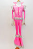 70s style Disco hot pink &silver flare jumpsuit has sequined leg, hip, shoulder & cuff accents. It has a stand-up collar & attached white cape. (Elvis wig optional) Front