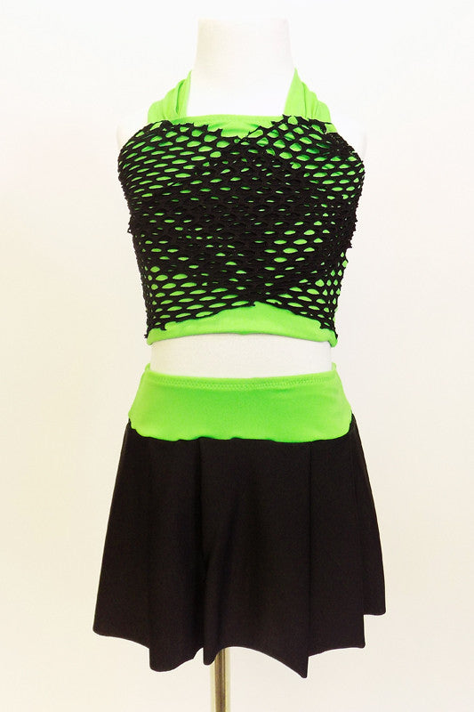 Neon green halter half-top has front cross over black mesh accent. It comes with a black skirt that has attached bottom and matching green waistband.  Front zoom