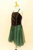 Dark green dress has velvet bodice with corset style lacing, painted designs and green crystal accents. The skirt is comprised of layers of flowing chiffon. Side