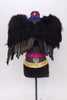 Black bra top has blue sequined halter attachment . The black shorts have a gold and magenta sequined waist band. Comes with a large detachable pair of  wings . Back