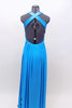 Floor length satin turquoise gown has jeweled trim at bust. The straps from the shoulder and bottom of bust line cross over at back. Has long chiffon train. Back