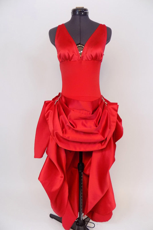 Red, ruched back, long sateen dress has short draped front for easy movement with crystal broach accents . Layered bustle effect carries through to  back. Front
