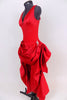 Red, ruched back, long sateen dress has short draped front for easy movement with crystal broach accents . Layered bustle effect carries through to  back. Side