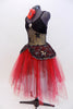 Black sequined, lace bodice accents romantic ballet tutu dress with crystal broach accent. Skirt is layers of black and red tulle.Has red floral hair accessory. Side