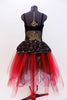 Black sequined, lace bodice accents romantic ballet tutu dress with crystal broach accent. Skirt is layers of black and red tulle.Has red floral hair accessory. Back