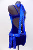 Royal blue velvet unitard with V-neck front and low back is covered with crystals throughout.Crystalled ribbons tie at back of neck. Has blue floral hair piece. Side
