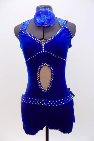 Royal blue velvet unitard with V-neck front and low back is covered with crystals throughout.Crystalled ribbons tie at back of neck. Has blue floral hair piece. Front