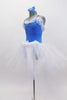 Blue leotard has draped white chiffon on bodice & large blue crystal broach accent. Has  long pull on tutu skirt with blue crystals & matching hair accessory. Side