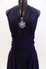 Navy halter dress has deep plunge front with large crystal broach. Has attached calf length open front skirt.Comes with pull on ruched waist band & hair piece. Front zoom