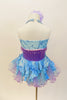 Lavender  and aqua leotard has tulle bustle skirt. Bodice is accented with lavender beads &  large purple sequined flower. Has is a large flower hair accessory. Back