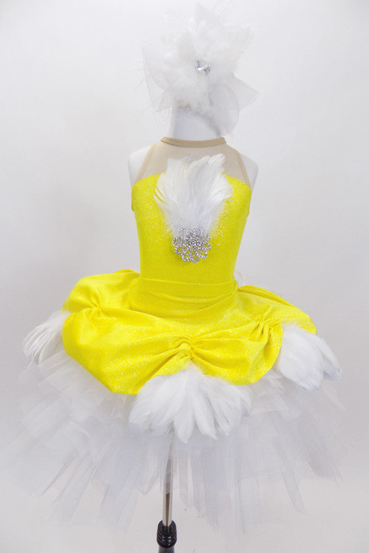 Yellow velvet overlay with white feathers rests on white tutu skirt. Matching leotard has large white crystal & feather accent &large white feather hair piece. Front