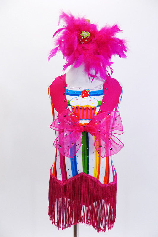Bright striped  unitard has hot pink collar, large cupcake applique & large pink bow with crystals. There is an attached pink fringe skirt & feather hair piece. Front
