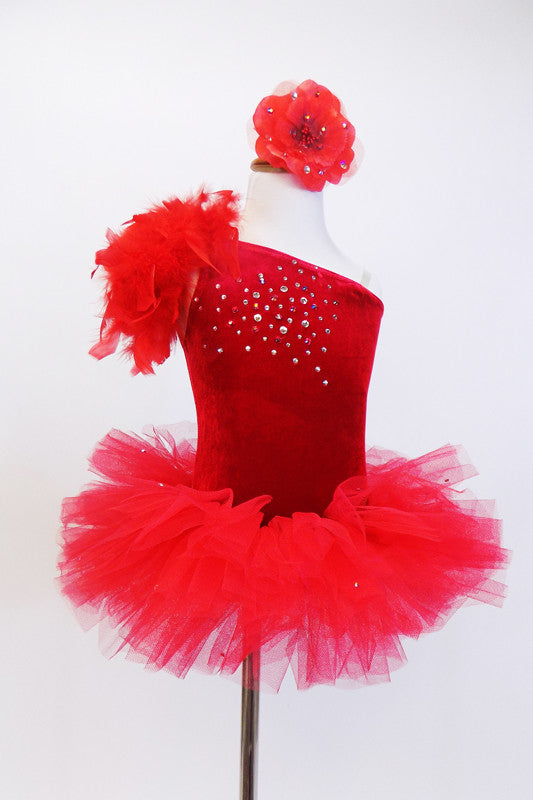 Deep red velvet one shoulder leotard has a cascade of crystals on front. Has a large boa feather spray off of the right shoulder & floral hair accessory. NEW Front