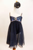 Charcoal A-line leotard dress has sweetheart bodice with  sequined lace and trim with crystal broach accent & scattered crystals. Has floral hair accessory. Front