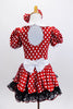 Red and white polk-a-dot dress has black petticoat with red sequin trim.Has white belt,collar & gloves. Comes with matching polk-a-dot hair bow. Back