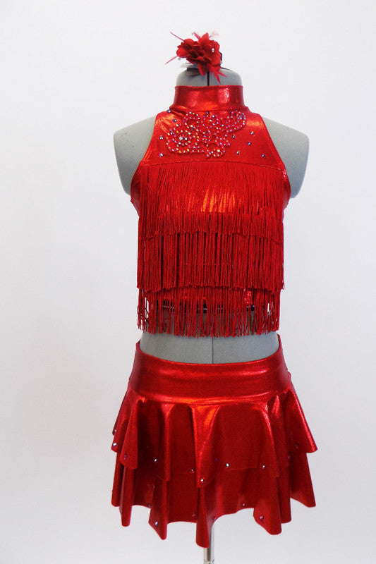 Red high neck half top has front crystal applique &layers of red fringe. Comes with hip skirt & attached panty. Has crystal accents & red floral hair accessory. Front