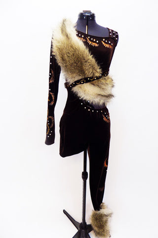 Brown one shoulder unitard has long sleeve. Has hand painted deigns of gold-copper swirls & crystals. There is a fur cuff on l calf of covered leg & fur sash. Front