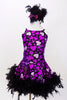 Purple leotard dress has  purple hearts & large purple sequined flower with beads on the left hip, The skirt has black boa feathers. Has matching hair accessory. Front