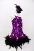 Purple leotard dress has  purple hearts & large purple sequined flower with beads on the left hip, The skirt has black boa feathers. Has matching hair accessory. Side