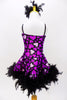 Purple leotard dress has  purple hearts & large purple sequined flower with beads on the left hip, The skirt has black boa feathers. Has matching hair accessory. Back