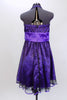 Purple halter  A-line knee length dress has black lace overlay & purple satin piping on petticoat. Has wide pleated  waistband with large satin bow under bust. Back