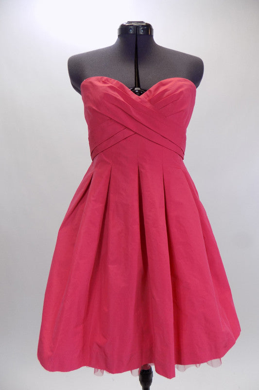 BCGB coral mini taffeta party dress has boned corset style bust area crossover front pleating accent. Has hidden side pockets & no-slip strip along top edge. Front