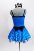 Bright aqua-blue patterned leotard dress has black waistband, double shoulder straps and a matching black hair bow. Back