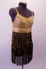 Gold and black flapper-style dress has gold swirl sequined base. The gold and black fringe skirt extends from a thick sequined band and gold belt with crystal heart belt buckle. Comes with a gold hair accessory. Side