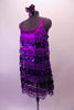 Flapper style tank dress makes a big pop with layered stripes of purple sequin and purple fringe, Comes with a purple floral hair accessory. Side