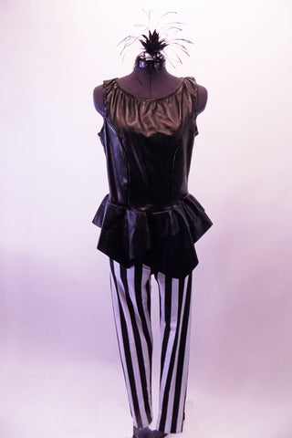 Black leatherette peplum waist zip back tank style top is accompanied by white and black striped leggings. Front