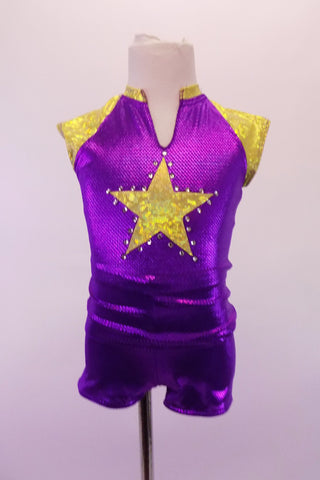 Purple and gold two-piece costume has a sporty feel with large crystal lined gold star at the front and one at the back pocket of the short. The gold shoulders and collar accent the stars. Front