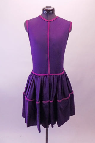 Purple knee-length traditional dress has a magenta band accents at the binding and gathered full skirt. The fully lined dress falls nicely as it moves. Front
