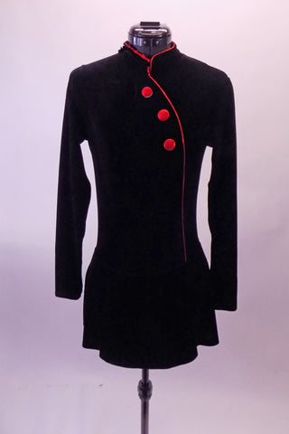 Black velvet mandarin collar long sleeved dress has asymmetric front closure and three red buttons. Front