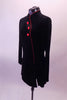 Black velvet mandarin collar long sleeved dress has asymmetric front closure and three red buttons. Side