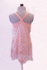 Blush camisole leotard dress has racer style back and a sheer lace overlay. The overlay is comprised of sections of seer lace, French floral lace, polka dot lace and lace rosettes. Comes with a blush chiffon floral accessory. Back