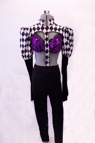 3-piece costume has a purple sequined bra (34B), with crystals, double back band & black ruffle. The black and white harlequin shrug has a mandarin collar and pouffe sleeve that is black from elbow down. There is a center strap that extends down the center of the torso to the waist of black leggings. Front