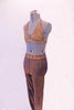 Two-piece costume has a stretch denim base with a gold over-dye. The halter-neck triangle bra is edged completely with amber crystals. The matching jegging has a crystalled waistband. Comes with a gold hair accessory. Side
