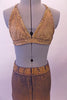 Two-piece costume has a stretch denim base with a gold over-dye. The halter-neck triangle bra is edged completely with amber crystals. The matching jegging has a crystalled waistband. Comes with a gold hair accessory. Front zoomed