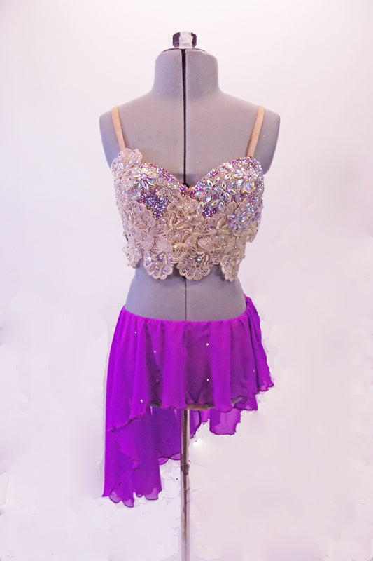 2-piece lyrical costume has a lavender chiffon angled skirt with an attached brief and scattered crystals. The breathtaking haft-bra top is comprised entirely of ivory beaded lace with Swarovski crystals and pearls. Comes with a lavender floral hair accessory. Front